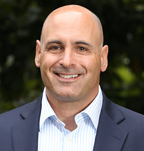 Headshot of Global 1's COO, Mike Caponnetto